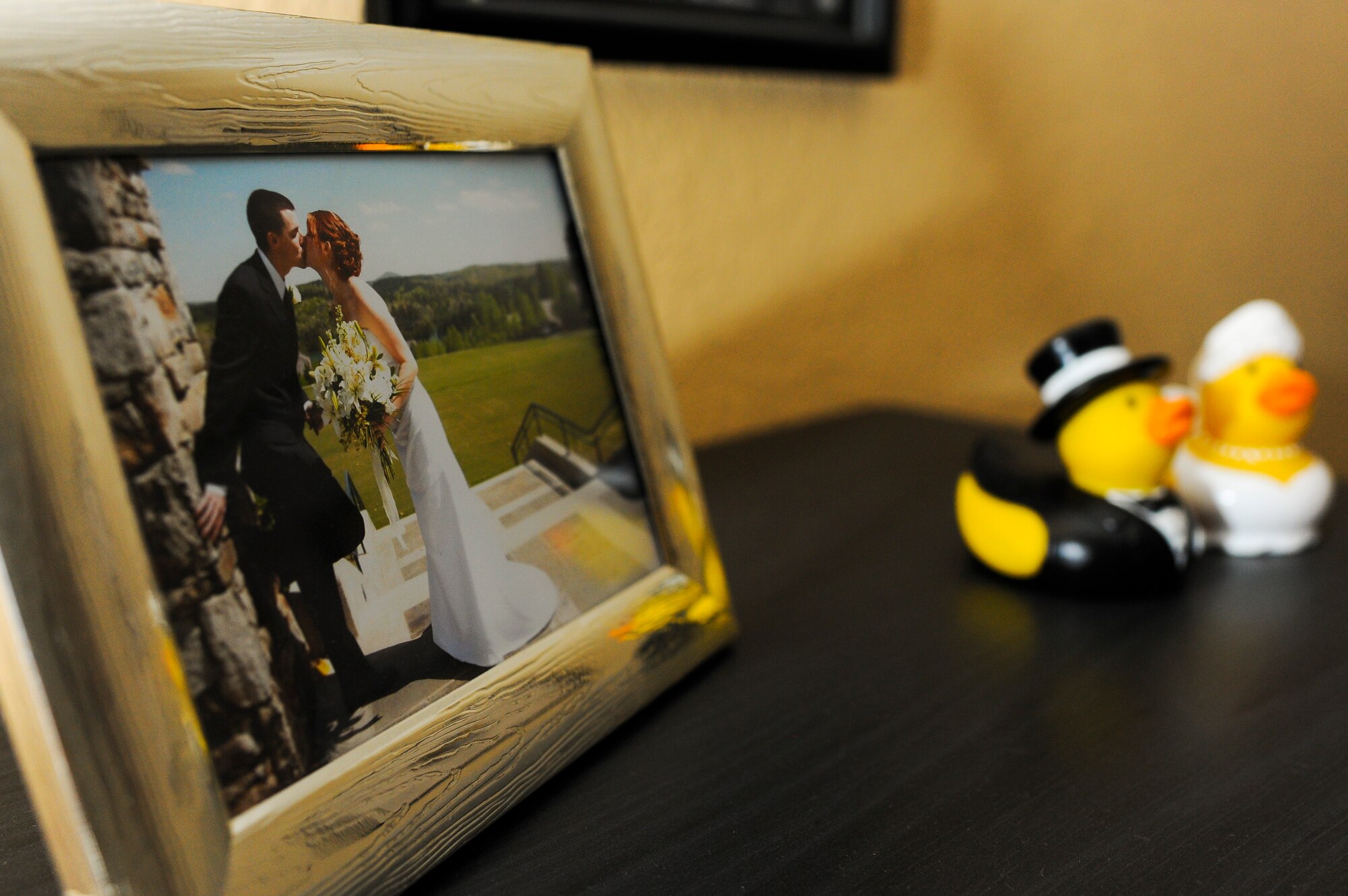 SPANGDAHLEM AIR BASE, Germany – A wedding photo is openly displayed in the Bigler home Jan. 13, 2014. U.S. Air Force Staff Sgt. Tyler Bigler deployed with the 606th Air Control Squadron in July 2013 in support of Operation Enduring Freedom. (U.S. Air Force photo by Senior Airman Rusty Frank/Released)
