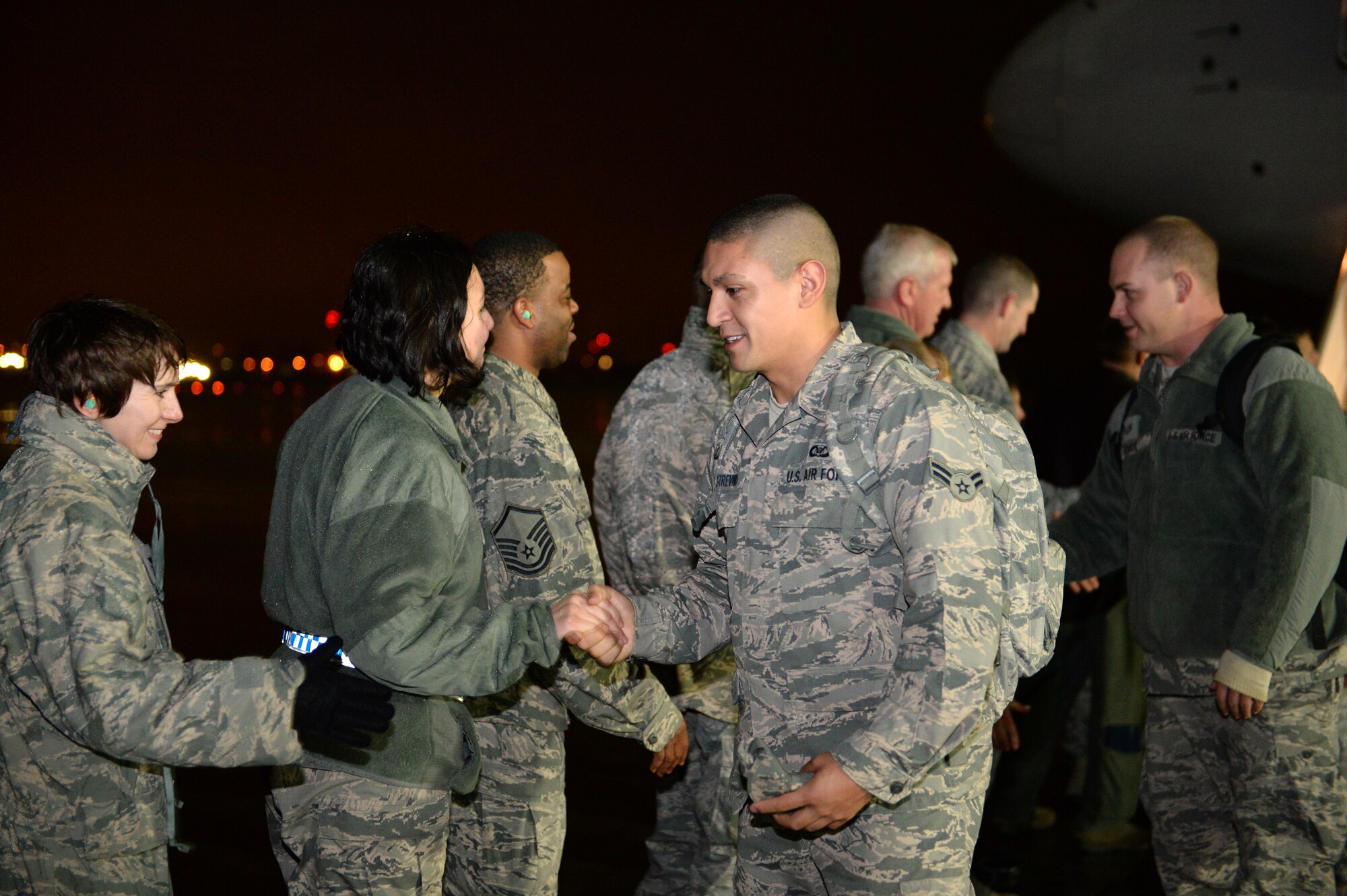 SPANGDAHLEM AIR BASE, Germany – Airmen from the 606th Air Control Squadron shake hands with Spangdahlem leadership after returning from a deployment to Southwest Asia Jan. 15, 2014. The 606th ACS, known as the "Inspectors of the Skies," originally activated Dec. 15, 1945, as the 606th Tactical Control Squadron. (U.S. Air Force photo by Senior Airman Alexis Siekert/Released)