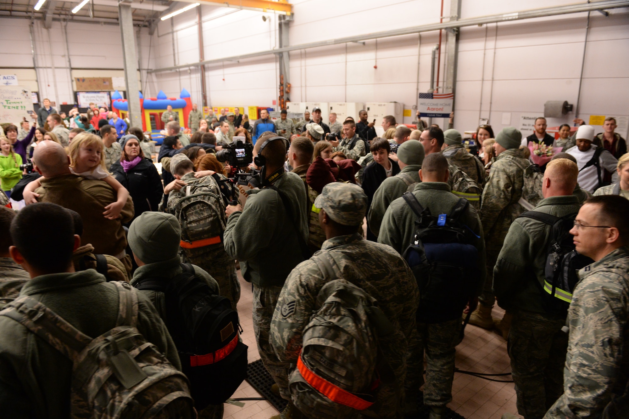 SPANGDAHLEM AIR BASE, Germany – Friends and Family are reunited with loved ones from the 606th Air Control Squadron Jan. 15, 2014, following six months in Southwest Asia. 606th ACS Airmen constantly “train as they fight” during annual week-long field exercises in which they exercise their ability to transport equipment and set up a control and reporting center. (U.S. Air Force photo by Staff Sgt. Daryl Knee/Released)