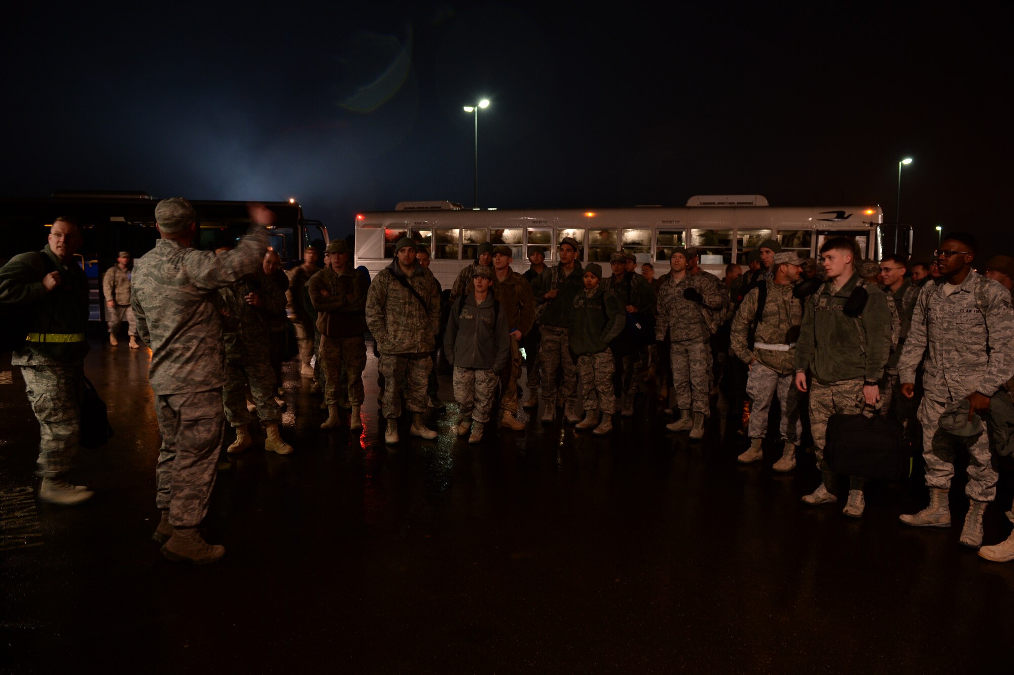 SPANGDAHLEM AIR BASE, Germany – U.S. Air Force Airmen receive a briefing before seeing their families Jan. 15, 2014. Members of the 606th ACS departed for Southwest Asia July 10, 2013, to provide air defense of the Arabian Gulf in support of Operation Enduring Freedom. (U.S. Air Force photo by Staff Sgt. Daryl Knee/Released)