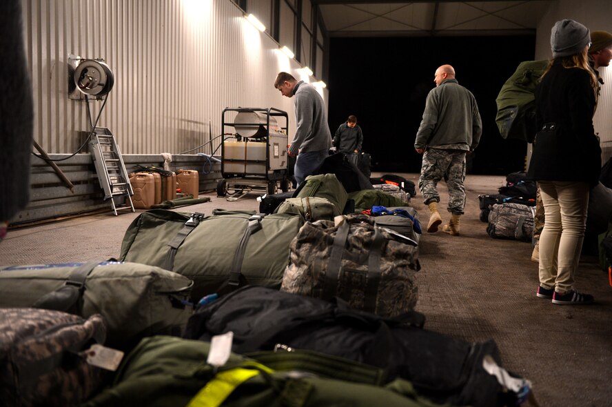 SPANGDAHLEM AIR BASE, Germany – Deployment bags await pick up as members of the 606th Air Control Squadron reunite with friends and family Jan. 15, 2014, following six months in Southwest Asia. The unit provides daily command and control to the 480th Fighter Squadron in addition to the occasional control of E-3A Sentry AWACS from NATO Air Base Geilenkirchen, Germany, and visiting aircraft from around the U.S. Air Forces in Europe scope of operations. (U.S. Air Force photo by Airman 1st Class Kyle Gese/Released)