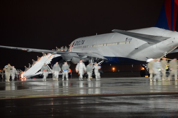 SPANGDAHLEM AIR BASE, Germany – U.S. Air Force Airmen from the 606th Air Control Squadron return from a deployment Jan. 15, 2014. Members of the 606th ACS departed for Southwest Asia July 10, 2013, to provide air defense of the Arabian Gulf in support of Operation Enduring Freedom. (U.S. Air Force photo by Airman 1st Class Kyle Gese/Released)