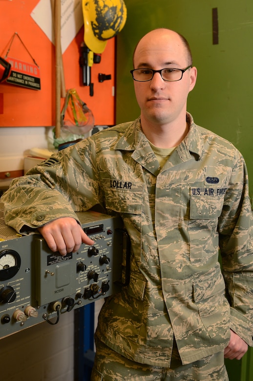 SPANGDAHLEM AIR BASE, Germany -- U.S. Air Force Senior Airman Alex Lollar, 606th Air Control Squadron radio frequencies transmissions technician from Pensacola, Fla., stands in front of his equipment Jan. 15, 2014. The 606th ACS recently deployed in support of Operation Enduring Freedom. Lollar supported the deployed members of the 606th ACS from Spangdahlem AB. (U.S. Air Force photo by Airman 1st Class Kyle Gese/Released)