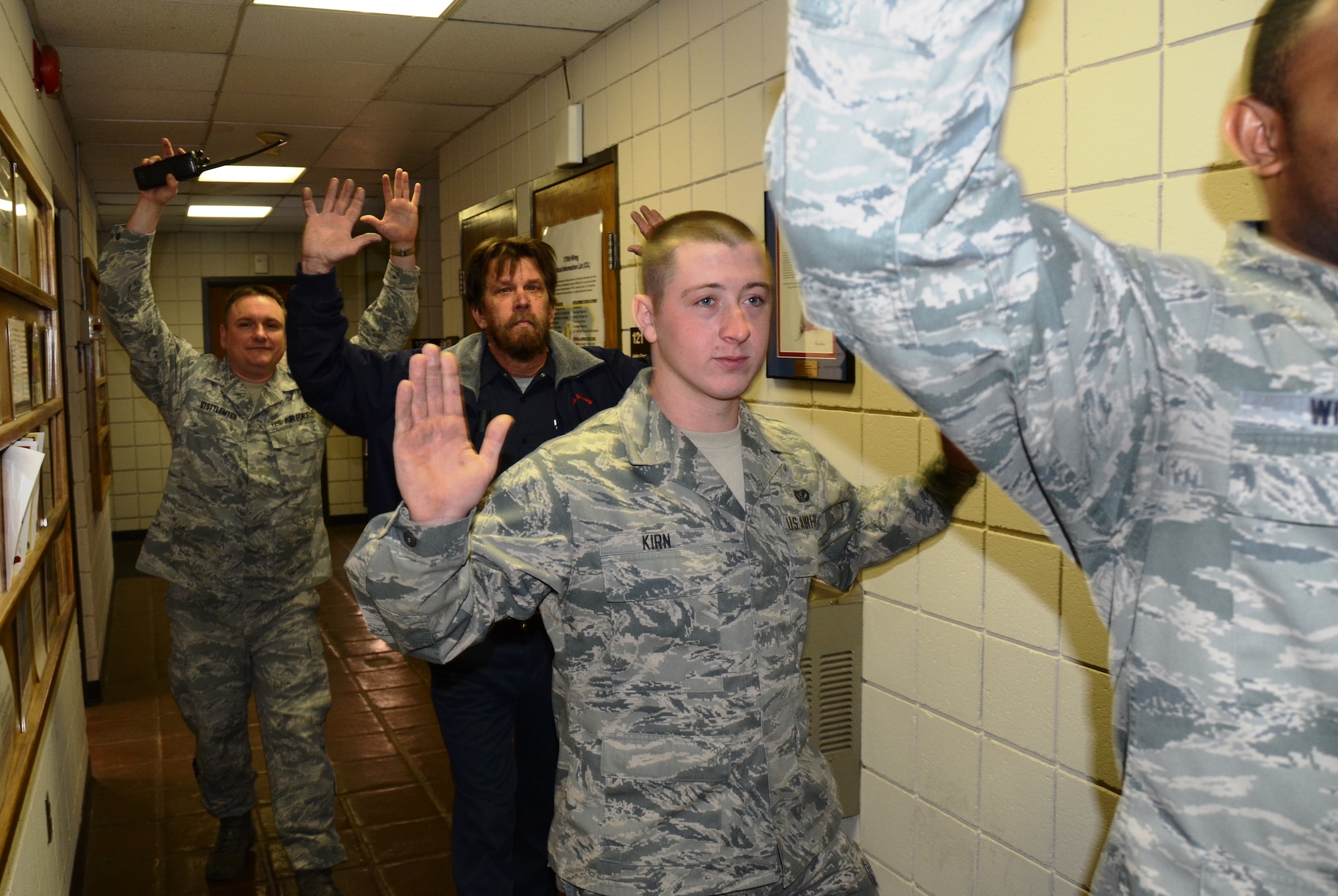 Civilian employees and Airmen of the Maryland Air National Guard leave the civil engineering building at Martin State Airport on Wednesday, January 15, 2014 during an active shooter exercise. The exercise allowed first responders from the Warfield Air National Guard Base and the local police a chance to work together in a simulated situation. (Air National Guard photo by Tech. Sgt. David Speicher/RELEASED)

 


 


