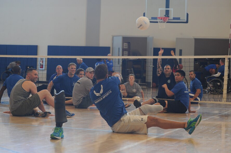 Air Force wounded warriors practice before seated volley ball portion of the inaugural Wounded Warrior Pacific Invitational at Joint Base Pearl Harbor-Hickam, Hawaii, Jan. 9, 2014. All enrollees in Air Force Wounded Warriors program are encouraged to make athletics an essential part of their recovery, rehabilitation and rehabilitation plans. (U.S. Air Force photo/Master Sgt. Matthew McGovern)
