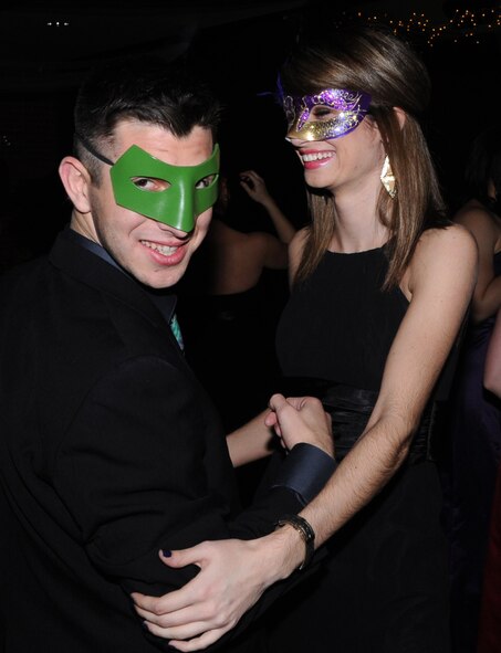 Second Lt. Alexios Gavrilos and his date join almost 100 Team Vance members on the dance floor during the first-ever Masquerade Ball, Jan. 11, at the Vance Collocated Club. (U.S. Air Force photo/ Senior Airman Frank Casciotta)