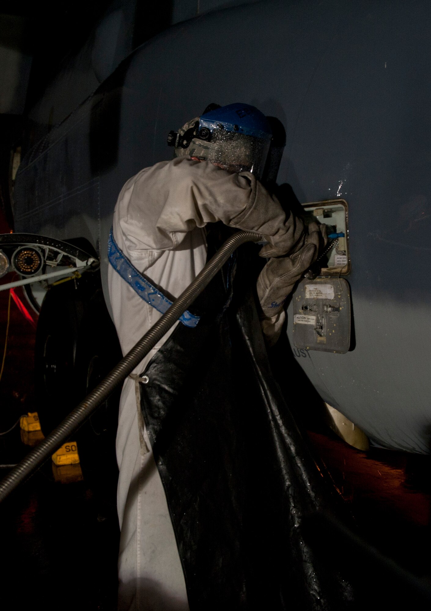 Airman 1st Class Mark Sherwood, 1st Special Operations Aircraft Maintenance Squadron crew chief, prepares an aircraft for liquid oxygen services on the flightline at Hulrburt Field, Fla., Jan. 13, 2014. LOX has a temperture of minus 297 degrees Fahrenheit and is extremely combustable. (U.S. Air Force photo/Senior Airman Krystal M. Garrett) 