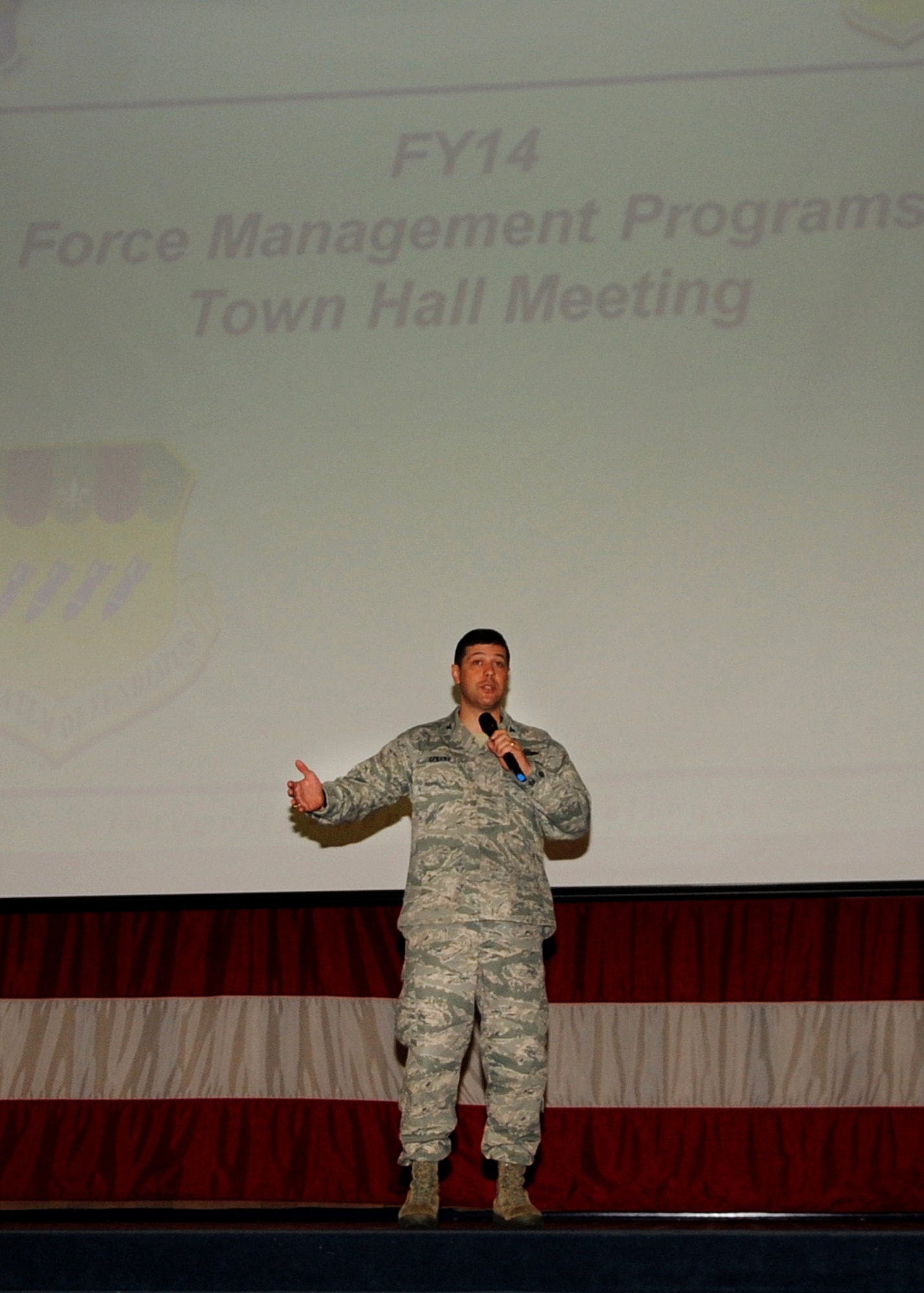 Col. Andrew Gebara, 2nd Bomb Wing commander, addresses Airmen during a town hall meeting on Barksdale Air Force Base, La., Jan. 14. During the town hall meeting, he discussed upcoming force management programs and how it would affect the Airmen of Team Barksdale. (U.S. Air Force photo/Senior Airman Kristin High)