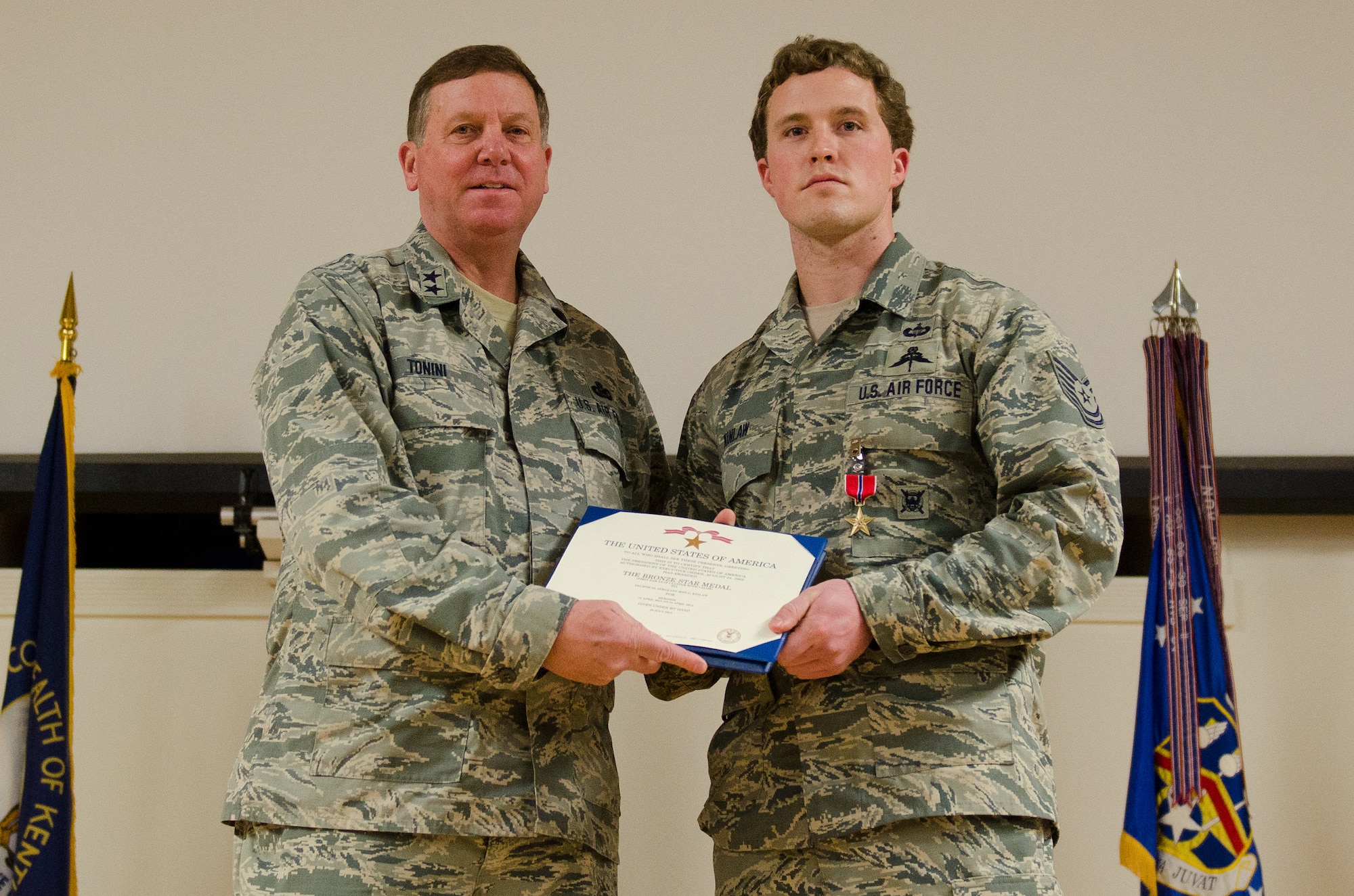 Kentucky’s adjutant general, Maj. Gen. Edward W. Tonini, presents Tech. Sgt. Jeff Kinlaw, a combat controller in the 123rd Special Tactics Squadron, with the Bronze Star Medal with Valor during an award ceremony held Jan. 12, 2014 at the Kentucky Air National Guard Base in Louisville, Ky. Kinlaw earned the award for heroism while conducting combat operations in Afghanistan in 2012. (U.S. Air National Guard photo by Airman 1st Class Joshua Horton)