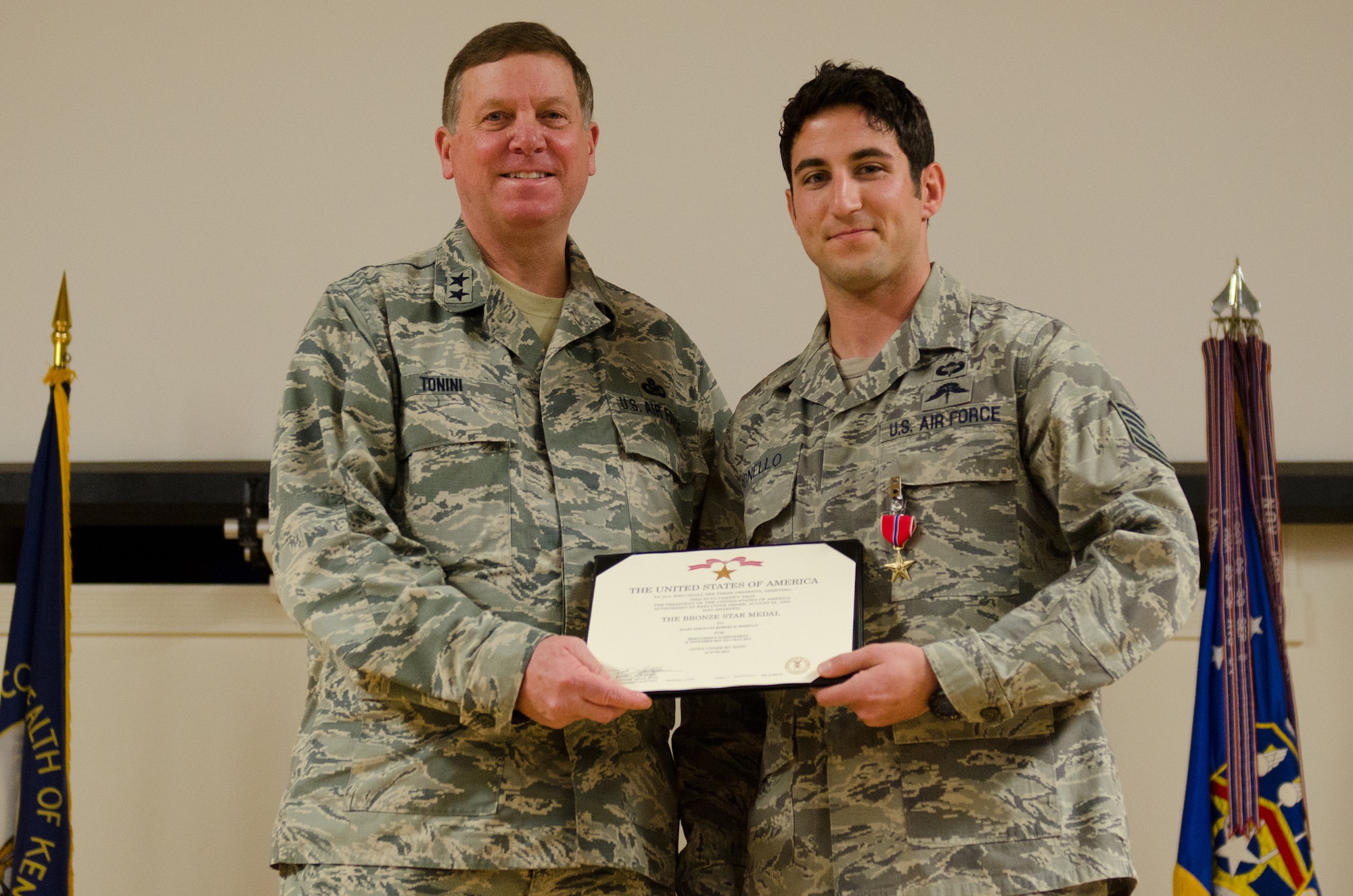 Kentucky’s adjutant general, Maj. Gen. Edward W. Tonini, presents Tech. Sgt. Robert Bonello, a combat controller in the 123rd Special Tactics Squadron, with the Bronze Star Medal with Valor during an award ceremony held Jan. 12, 2014 at the Kentucky Air National Guard Base in Louisville, Ky. Bonello earned the award for heroism while conducting combat operations in Afghanistan in 2012. (U.S. Air National Guard photo by Airman 1st Class Joshua Horton)