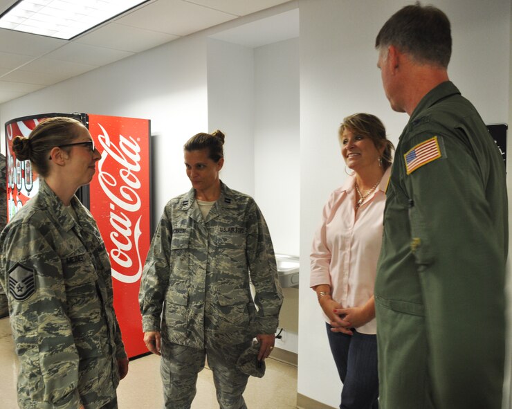 Col. Larry Shaw, 927th Operations Group Commander, his wife Ms. Kris Shaw and Capt. Donna Marchaesi, 45th Aeromedical Evacuation Squadron, talk with Master Sgt. Shannon Meinert, 927th Operations Support Flight, about the details of her upcoming deployment.