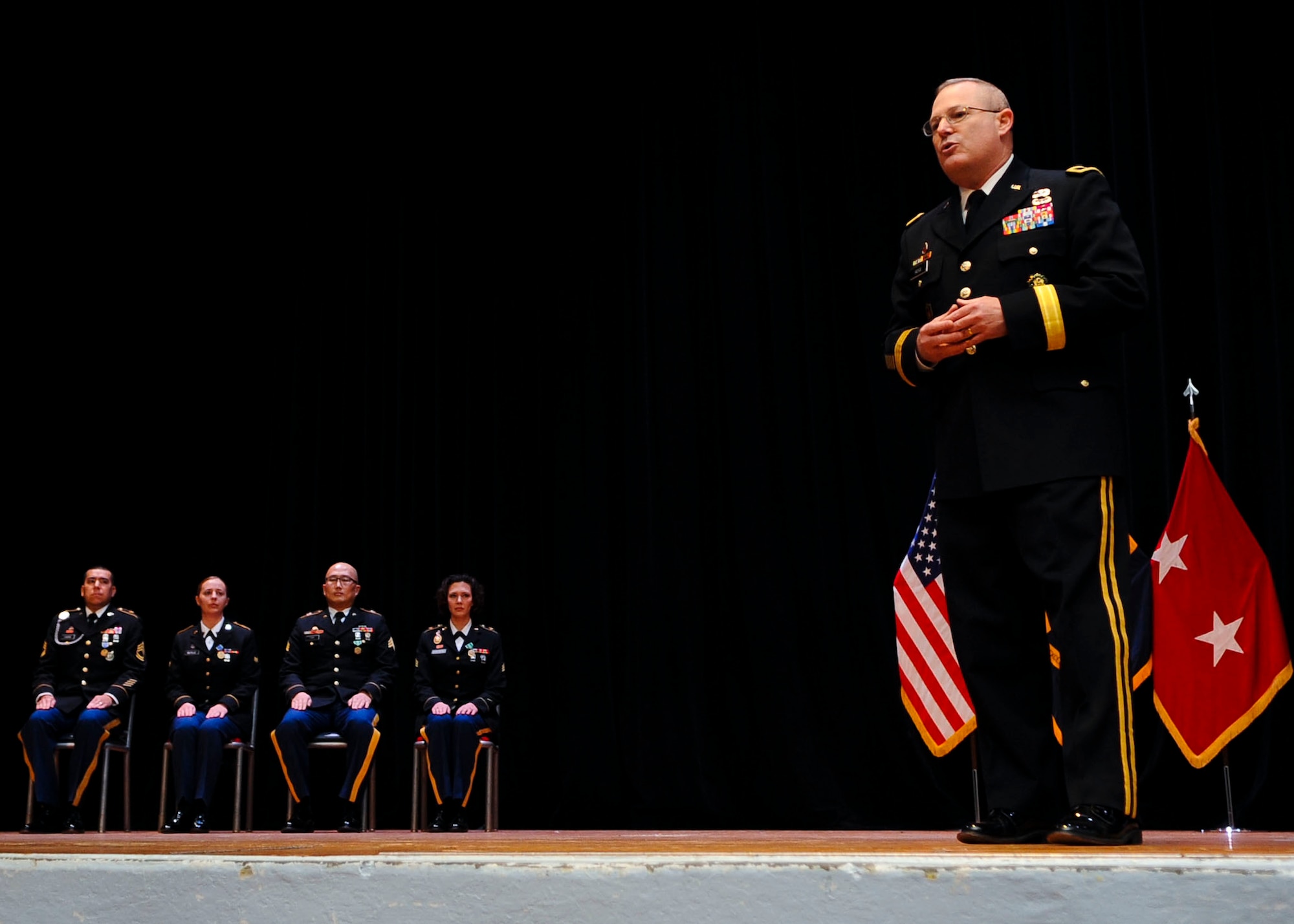 U.S. Army Maj. Gen. Ross Ridge, U.S. Army Training and Doctrine Command Initial Military Training deputy commanding general, speaks during the Soldier and Noncommissioned Officer of the year ceremony Jan. 13, 2014, at Fort Eustis, Va. Ridge commended all participants for their diligence, and challenged leaders across Fort Eustis to continue providing the Army with quality professionals. (U.S. Air Force photo by Airman 1st Class Austin Harvill/Released)
