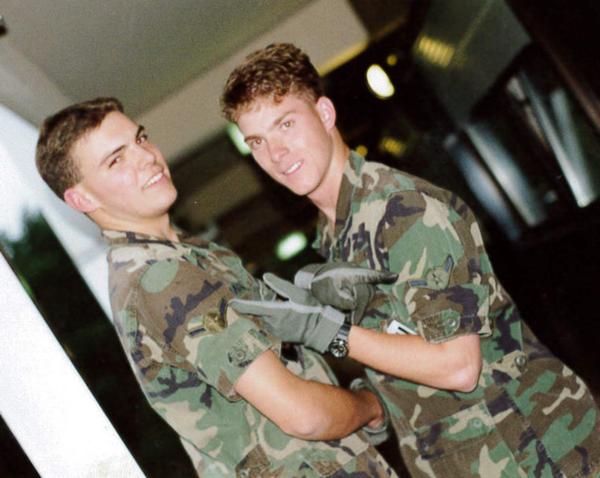Then, Airman Jeffrey Woolford poses with a fellow Airman at his first duty station Ramstein Air Base, Germany. Maj. (Dr.) Woolford enlisted in the Air Force as an aircraft maintenance crew chief in 1989, and commissioned as an A-10 Thunderbolt II pilot in 1998. Woolford realized he wanted to become a pilot while assigned to Ramstein. (U.S. Air Force courtesy photo)