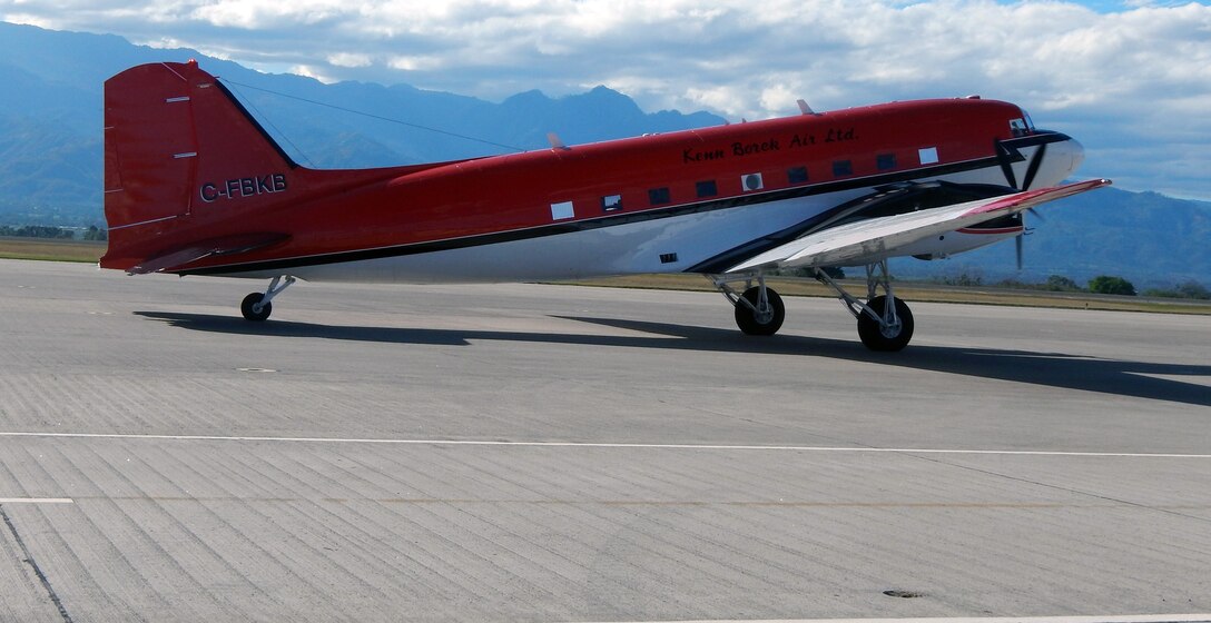 A DC-3 aircraft sits on the flightline at Soto Cano Air Base, Honduras, Dec. 13, 2014.  The DC-3 is from the Naval Oceanographic Office and will be used to conduct laser mapping operations off the coast of Honduras.  (U.S. Air Force photo by Tech. Sgt. Stacy Rogers)