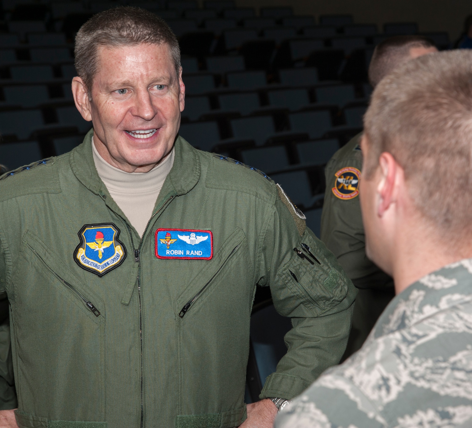 Gen. Robin Rand, Air Education and Training Command commander, speaks with airmen at Laughlin Air Force Base, Texas, Jan. 9, 2014. Rand, along with his wife, Kim Rand, and Chief Master Sgt. Gerardo Tapia, AETC command chief, met with leadership, toured the base, and spoke with Team XL during a two-day site visit of the 47th Flying Training Wing. (U.S. Air Force photo/Senior Airman Nathan Maysonet)