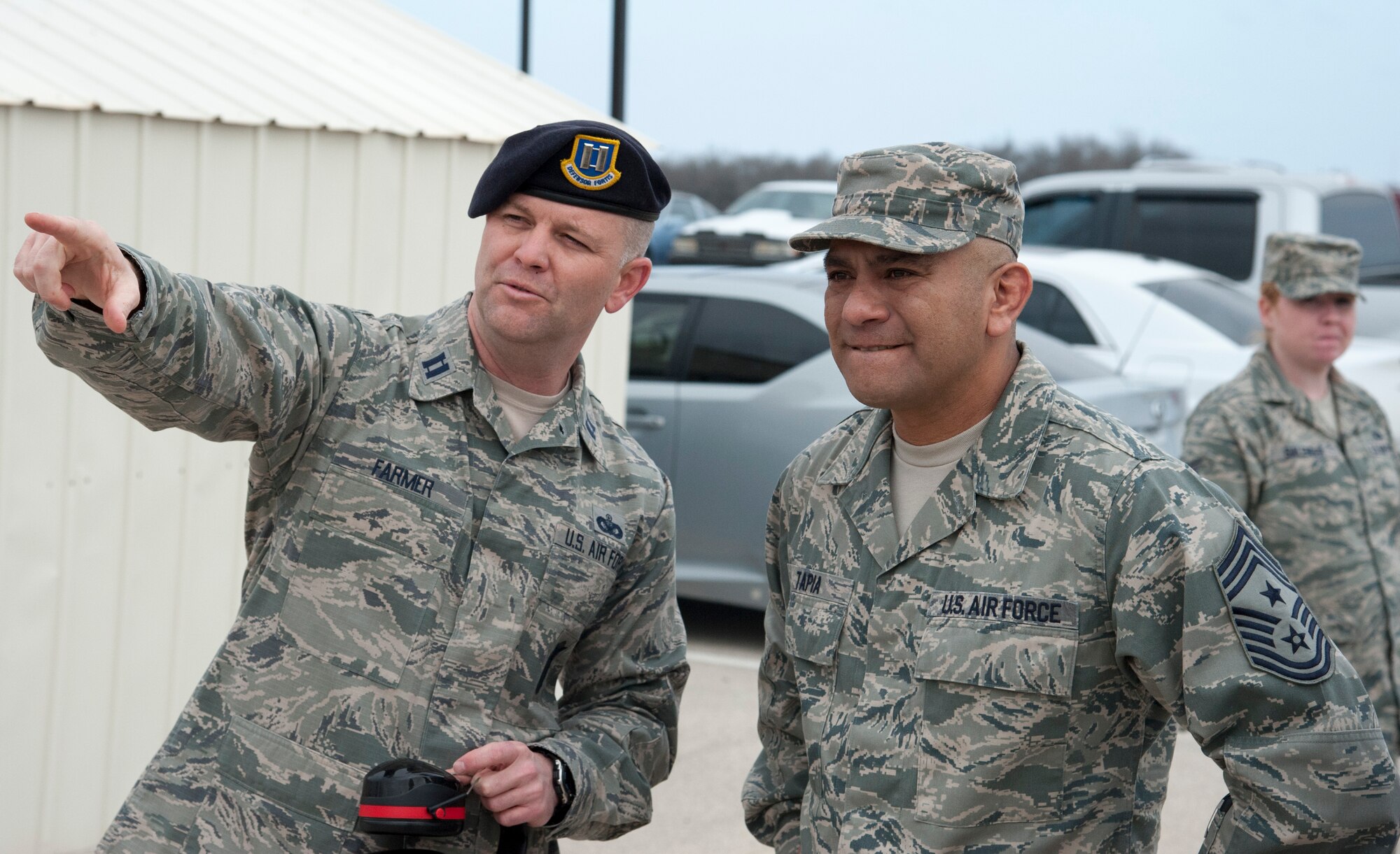 Chief Master Sgt. Gerardo Tapia, Air Education and Training Command command chief, speaks with Capt. John Farmer, 47th Security Forces Squadron commander, Laughlin Air Force Base, Texas, Jan. 9, 2014. Tapia shot with Chief Master Sgt. Garry Berry, 47th Flying Training Wing command chief. (U.S. Air Force photo/Airman 1st Class Jimmie D. Pike)