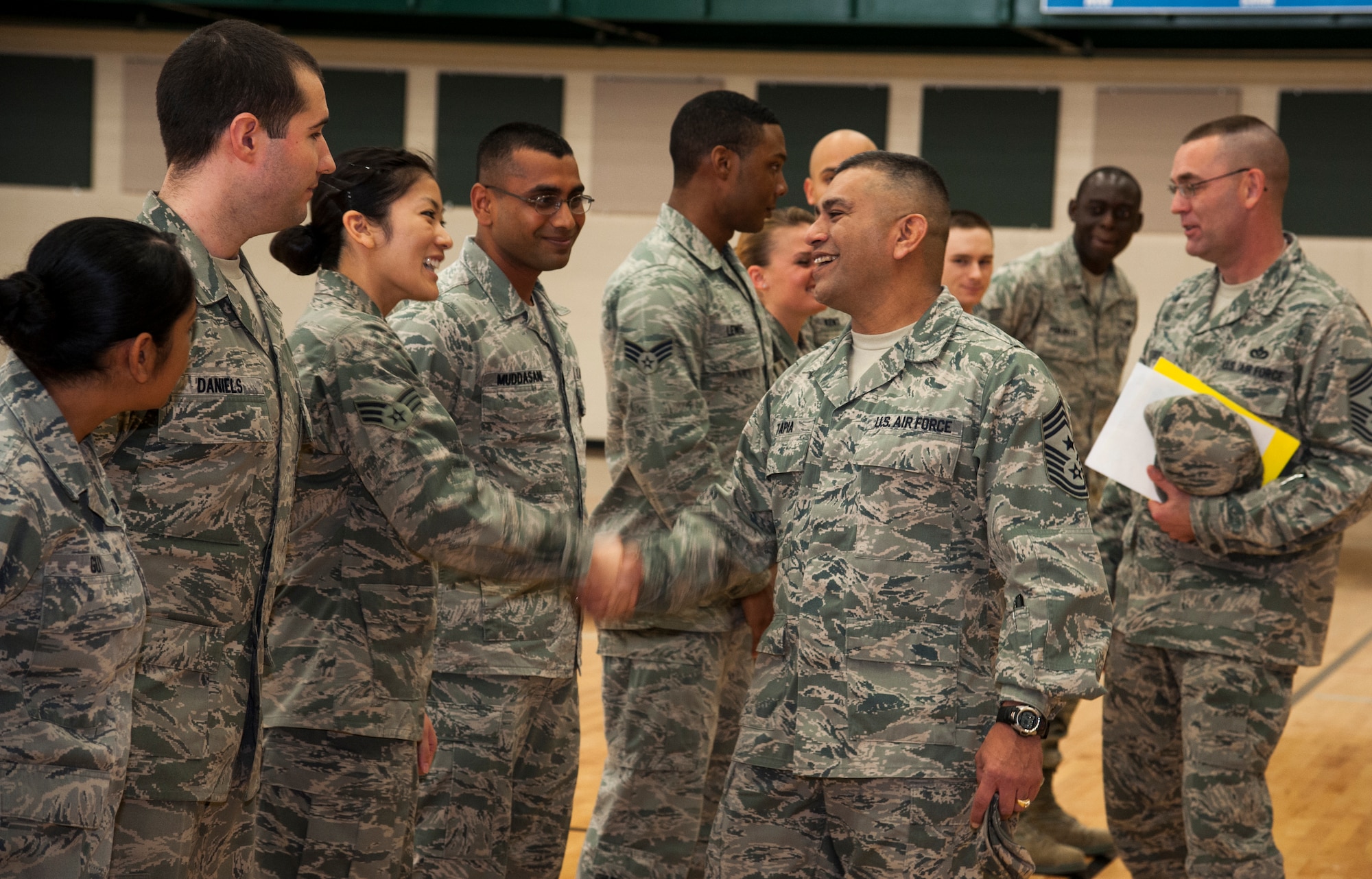 Chief Master Sgt. Gerardo Tapia, Air Education and Training Command command chief, meets and speaks with Laughlin’s Honor Guard team members at the Losano Fitness Center on Laughlin Air Force Base, Texas, Jan. 9, 2014. He spoke about the importance of the honor guard and how they serve those who have served. (U.S. Air Force photo/Airman 1st Class Jimmie D. Pike)