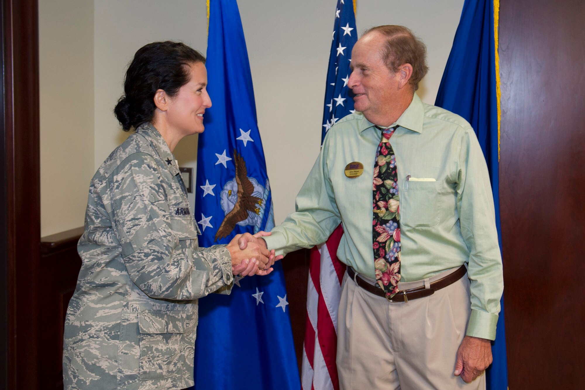 Brig. Gen. Nina Armagno, 45th Space Wing commander, presents Lt. Col. (ret) Jerry Meyer with his 4,000 volunteer hours Certificate of Appreciation. In addition to serving 4,000 hours to Project Emeritus, he has volunteered with the Red Cross, Patrick AFB Pharmacy, Daily Bread, Meals on Wheels, Melbourne Police Department, and track and field events at local high schools and colleges. (U.S. Air Force photo/Matthew Jurgens)