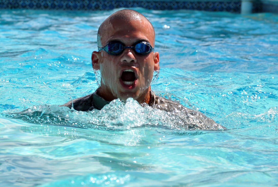 Members of Joint Task Force-Bravo participate in a 100 meter swim while in uniform during testing for the German Armed Forces Proficiency Badge at Soto Cano Air Base, Honduras, Jan. 14, 2014. Several members of Joint Task Force-Bravo are attempting to qualify for the German Armed Forces Proficiency Badge this week. In order to qualify for the badge, service members must pass both a fitness test and a military training test, administered by a German Sergeant Major. Today, JTF-Bravo members completed an 11x10 meter spring test, a chin-up (flexed arm hang) test, a 1,000 meter run and a 100 meter swim in uniform. The German Armed Forces Proficiency Badge (German: Abzeichen für Leistungen im Truppendienst) is a decoration of the Bundeswehr, the Armed Forces of the Federal Republic of Germany. The decoration can be awarded to all German Soldiers. Allied Soldiers may also be awarded the badge. Any rank may be awarded and wear the badge. In the United States Military the German Armed Forces Proficiency Badge is one of the few approved foreign awards, and it is one of the most sought after awards to achieve. (U.S. Air Force photo by Capt. Zach Anderson)
