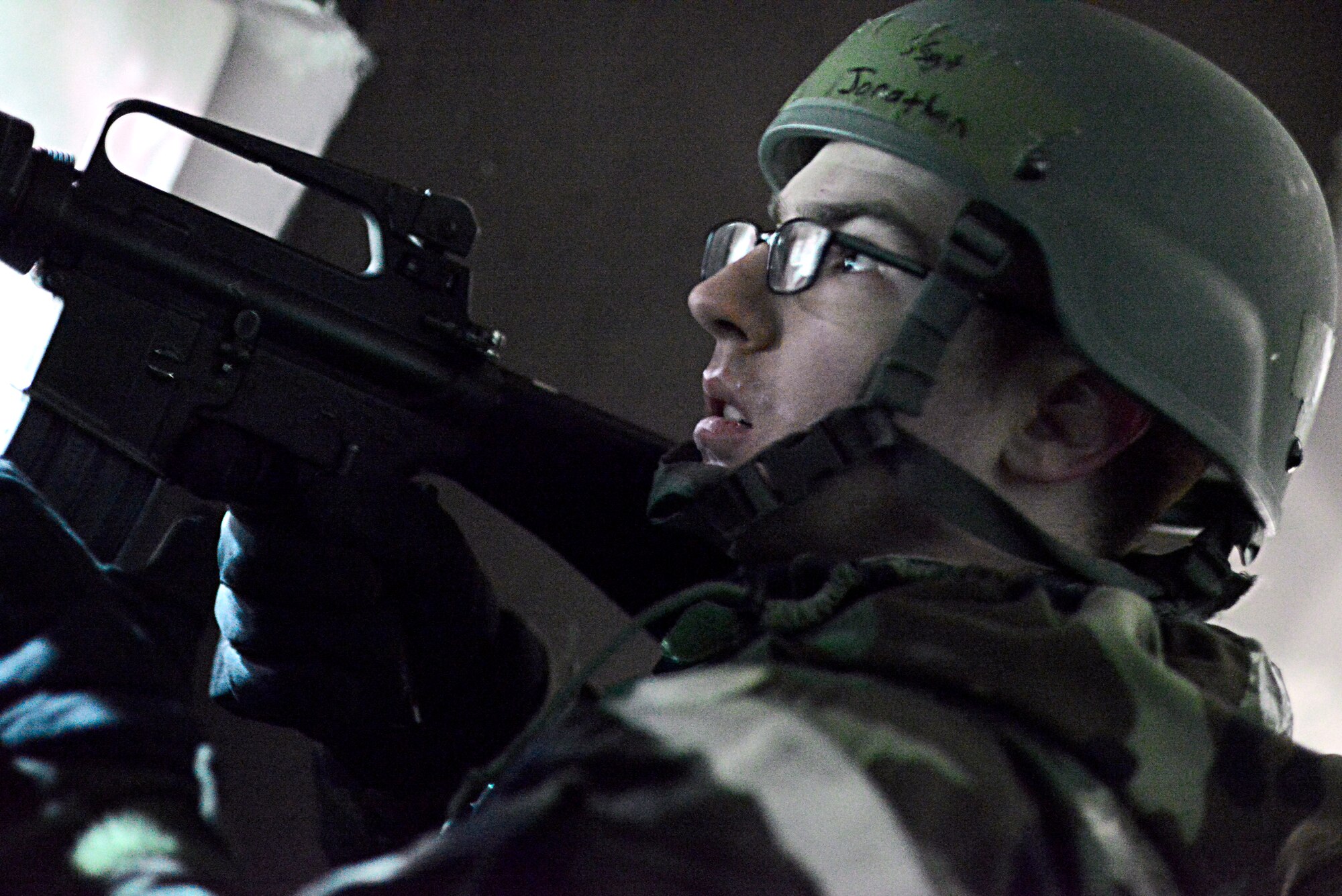 A member of the 51st Communications Squadron Installation Arming and Response Team engages opposition forces role players during Operational Readiness Exercise Beverly Midnight 14-01 at Osan Air Base, Republic of Korea, Jan. 14, 2014. During this particular scenario, the IA&RT teamed up with the 51st Security Forces Squadron to neutralize opposition forces that were attacking the 51st CS compound. (U.S. Air Force photo/ Tech. Sgt. Micky Bazaldua)