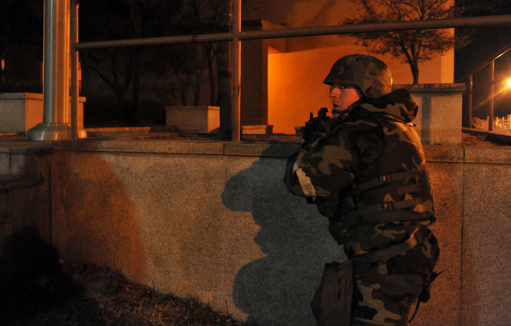 A 51st Security Forces Squadron augmentee looks for opposition forces role players during Operational Readiness Exercise Beverly Midnight 14-01 at Osan Air Base, Republic of Korea, Jan. 14, 2014. Exercises like BM 14-01 tests 51st SFS members on their ability to defend the base during ground attacks. (U.S. Air Force photo/Senior Airman Siuta B. Ika)