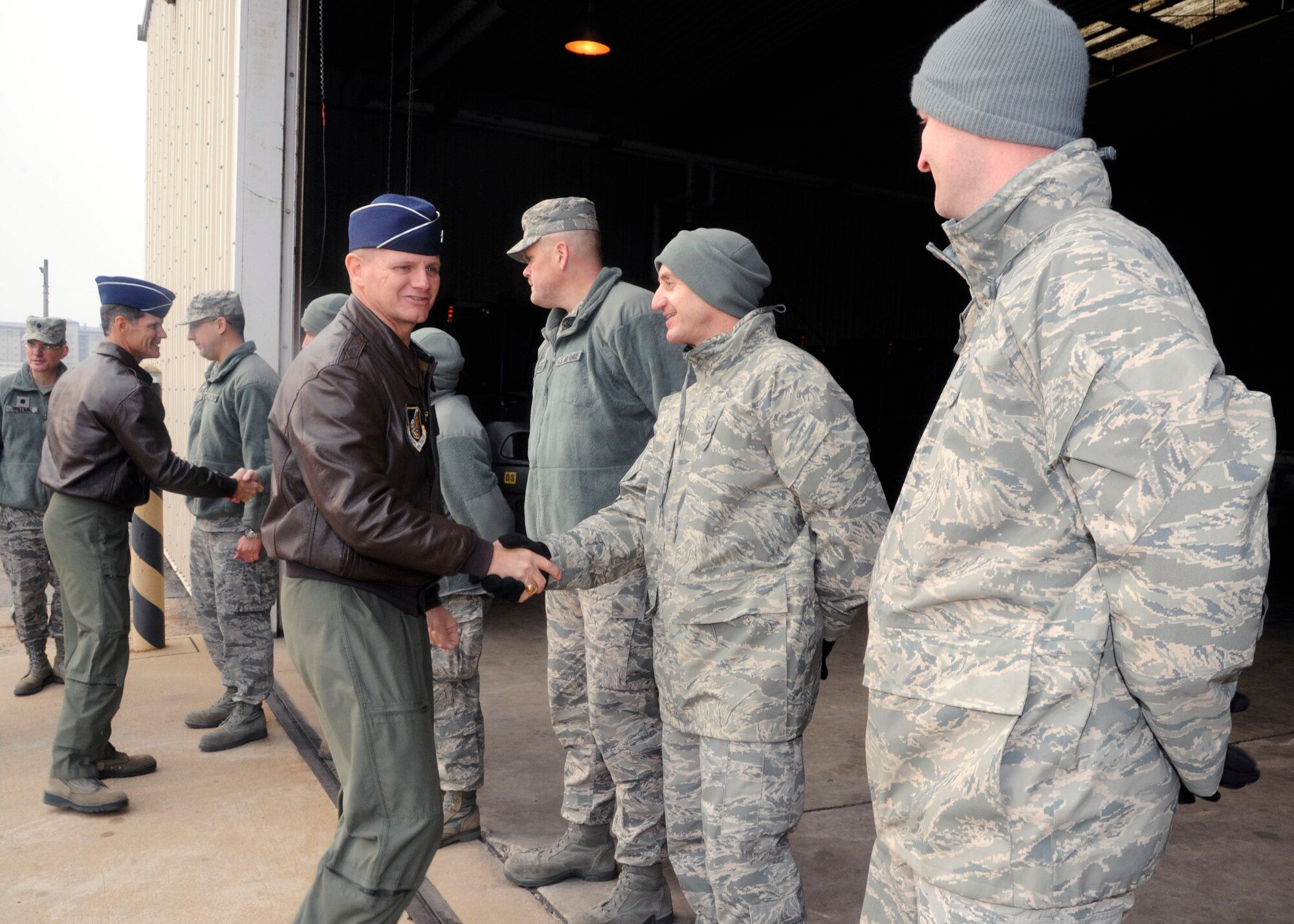 Brigadier Gen. Russell Mack, 7th Air Force vice commander, greets members of the 8th Logistics Readiness Squadron at Kunsan Air Base, Republic of Korea, Jan. 10, 2014. The general was briefed on the roles 8th LRS facilities play in peace and wartime, to include the 8th LRS Vehicle War Reserve Materiel warehouse. (U.S. Air Force photo by Staff Sgt. Jessica Haas/Released)