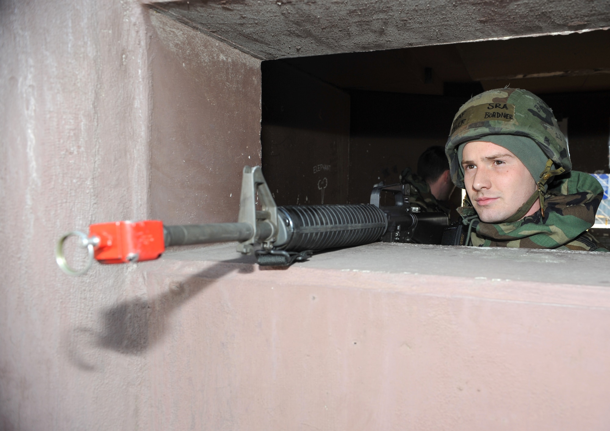 Senior Airman Tyler Bordner, 51st Logistics Readiness Squadron vehicle maintenance technician, mans a defensive fighting position during Operational Readiness Exercise Beverly Midnight 14-01 at Osan Air Base, Republic of Korea, Jan. 14, 2014. Bordner was part of a training scenario that allowed members of the 51st Security Forces Squadron to sharpen the defensive techniques they would use during an actual ground attack.  (U.S. Air Force photo/Airman 1st Class Ashley J. Thum)