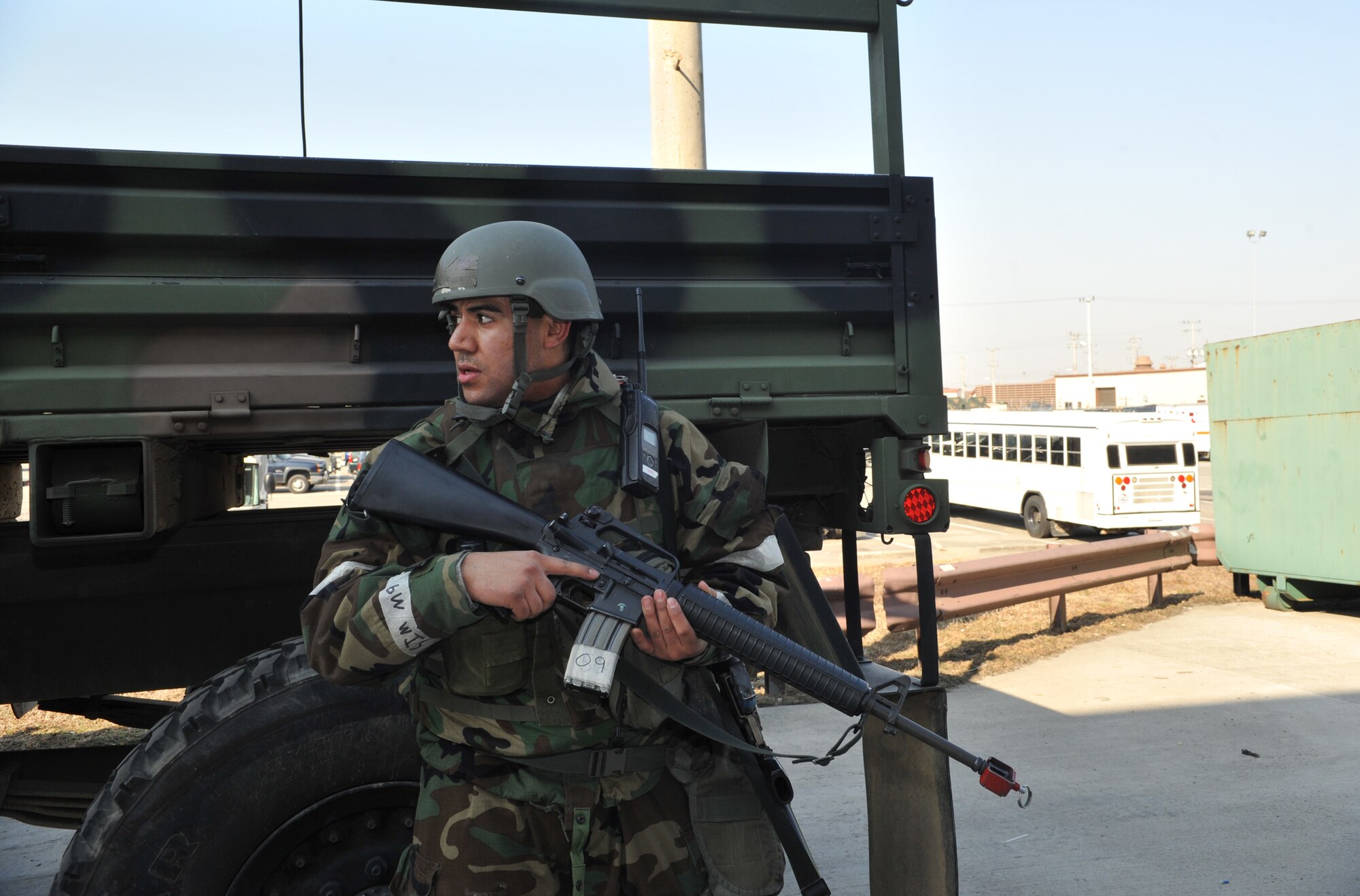 A member of the 51st Logistics Readiness Squadron keeps an eye out for opposition forces role players during Operational Readiness Exercise Beverly Midnight 14-01 at Osan Air Base, Republic of Korea, Jan. 14, 2014. The role players hid in several spots around Bldg. 1332 in an attempt to take over the area. (U.S. Air Force photo/Airman 1st Class Ashley J. Thum)