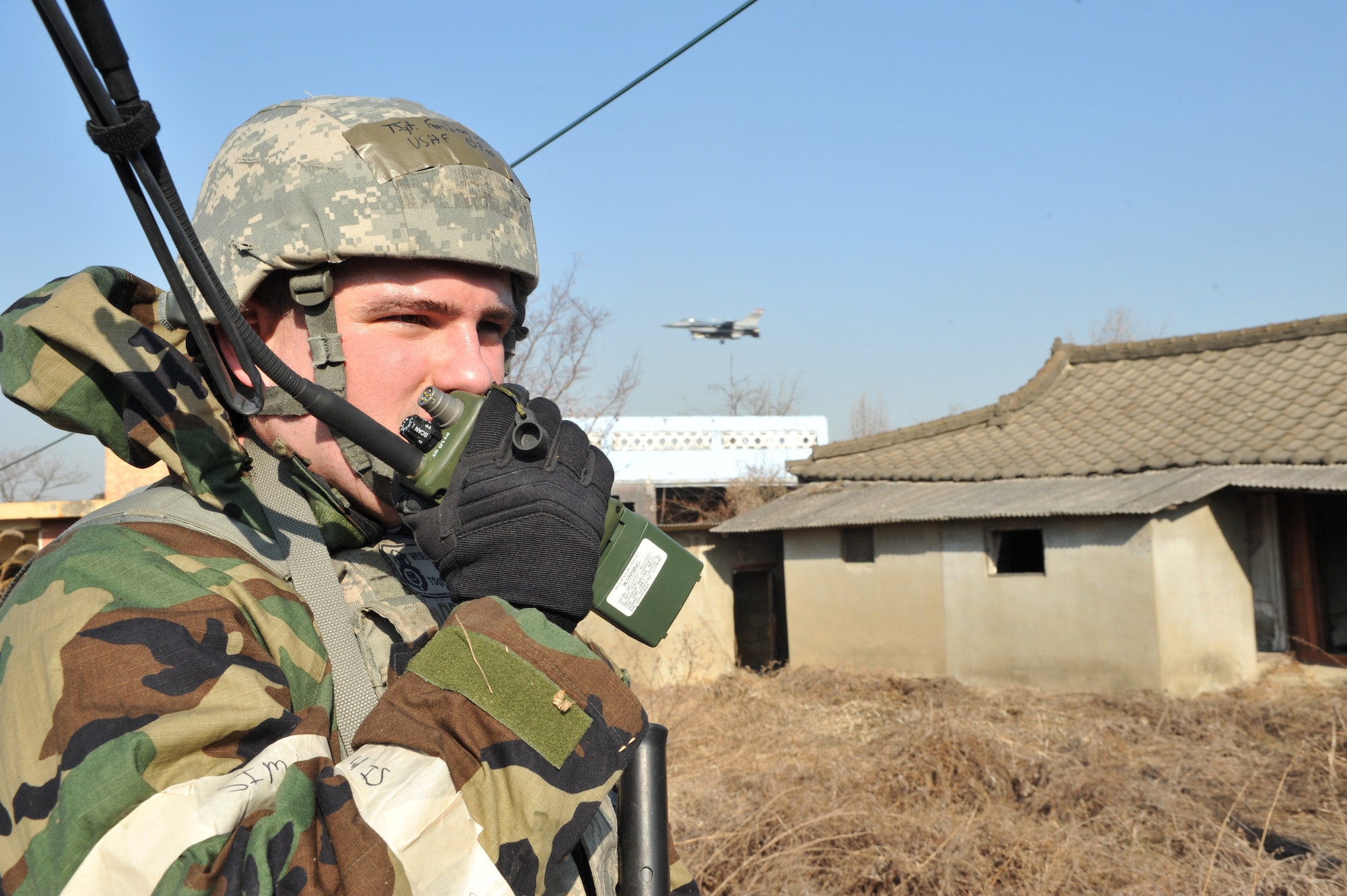 Tech. Sgt. Wesley Forsberg, a defender with the 51st Security Forces Squadron, calls in a simulated dead, injured and missing count at the conclusion of a ground attack scenario during Operational Readiness Exercise Beverly Midnight 14-01 in a training area outside Osan Air Base, Republic of Korea, Jan. 14, 2014. The DIM count was used to help assess the outcome of the simulated engagement with members of opposition forces. (U.S. Air Force photo/Airman 1st Class Ashley J. Thum)