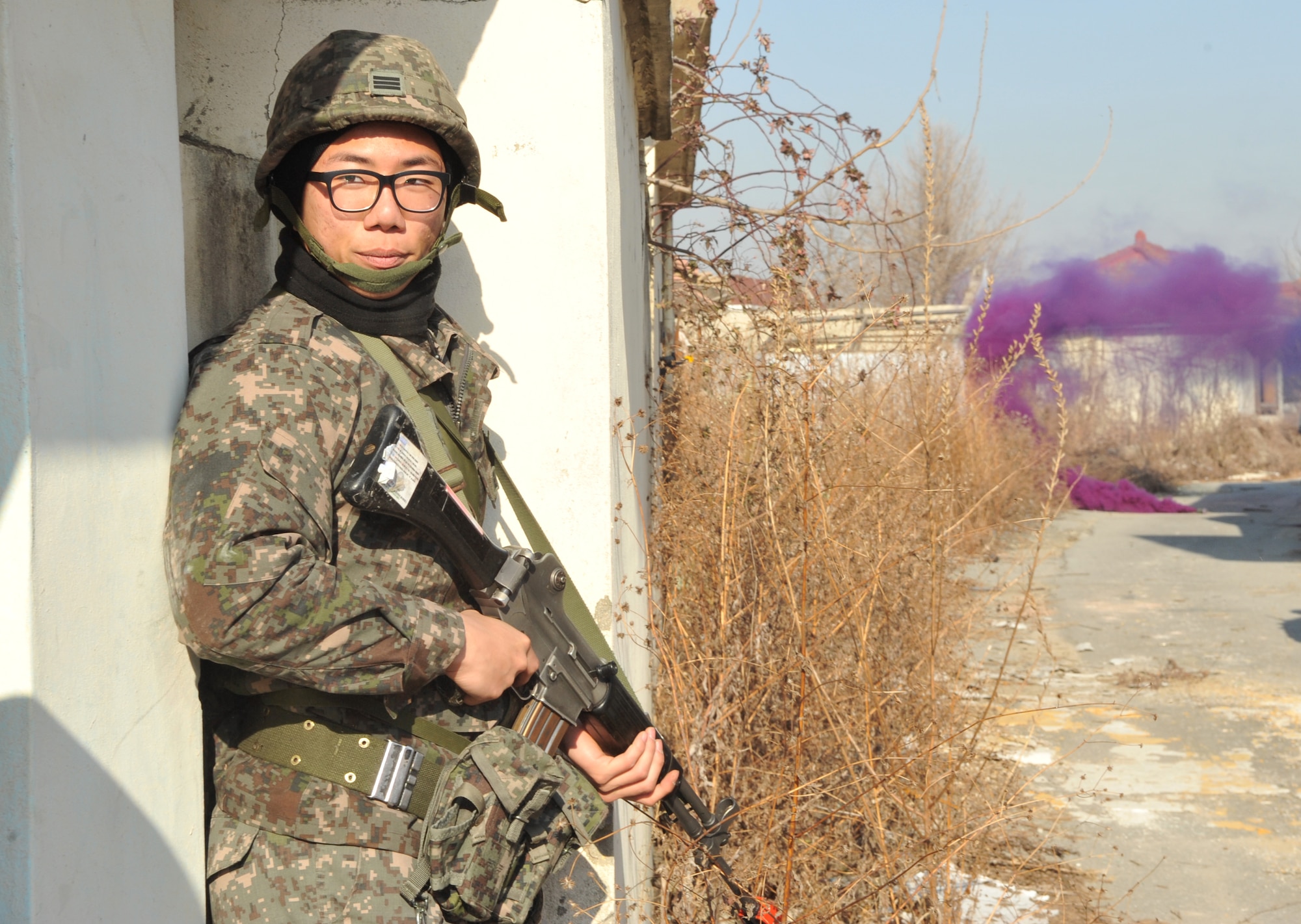 A member of the Republic of Korea army stands watch during an Operational Readiness Exercise Beverly Midnight 14-01 scenario in a training area outside Osan Air Base, ROK, Jan. 14, 2014. The ROK military frequently partners with members of the 51st Fighter Wing during OREs to take advantage of the opportunity to rehearse maneuvers which would be implemented in real-world missions. (U.S. Air Force photo/Airman 1st Class Ashley J. Thum)