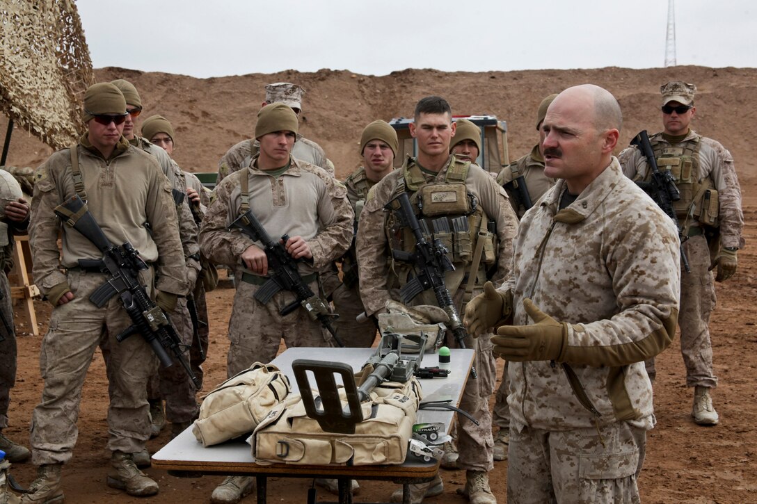 U.S. Marine Corps Chief Warrant Officer 3 Ronald Hathaway gives a range class on Camp Leatherneck in Afghanistan's Helmand province, Jan. 9, 2014. The Marines practiced nonlethal ways to stop a possible enemy attack. Hathaway is a battalion gunner assigned to 3rd Battalion, 7th Marine Regiment.