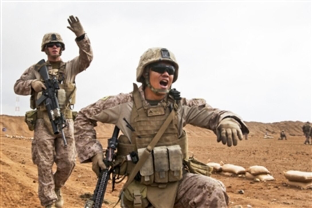 U.S. Marine Corps Cpl. Jason Tutchtone, left, and Lance Cpl. Byronalex Constantino conduct drills based on the rules of engagement on Camp Leatherneck in Afghanistan's Helmand province, Jan. 9, 2014. 