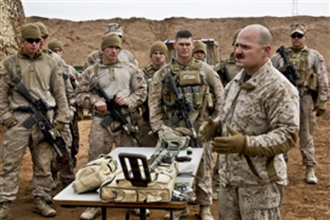 U.S. Marine Corps Chief Warrant Officer 3 Ronald Hathaway gives a range class on Camp Leatherneck in Afghanistan's Helmand province, Jan. 9, 2014. The Marines practiced nonlethal ways to stop a possible enemy attack. Hathaway is a battalion gunner assigned to 3rd Battalion, 7th Marine Regiment.