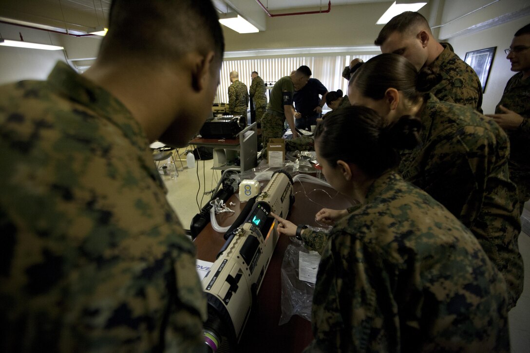 Naval medical personnel execute the startup process of the mobile, oxygen, ventilation and external suction system Jan. 7 at Camp Kinser. The sailors are with 3rd Medical Battalion, 3rd Marine Logistics Group, III Marine Expeditionary Force. (U.S. Marine Corps photo by Pfc. Donald T. Peterson/Released)