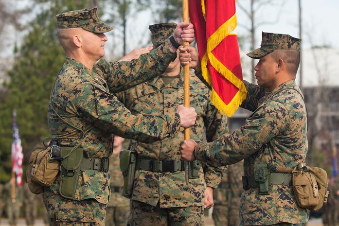 Lt. Col. David T. Hudak (left), a Warren, Ohio native and the incoming battalion commander of 8th Engineer Support Battalion, 2nd Marine Logistics Group, II Marine Expeditionary Force, receives the battalion’s colors from Lt. Col. Ferdinand F. Llantero (right), a Long Beach, Calif., native and the outgoing battalion commander during a traditional change of command ceremony at Soiffert field aboard Camp Lejeune, N.C., Jan. 15, 2014. In 2010, Llantero was promoted to his current rank and was selected for command and reported to 8th ESB in December 2011.