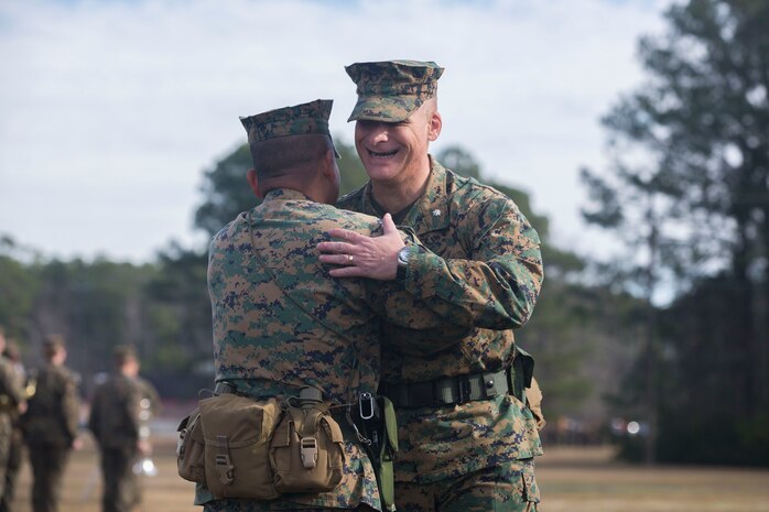 Lt. Col. David T. Hudak (right), a Warren, Ohio native and the incoming battalion commander of 8th Engineer Support Battalion, 2nd Marine Logistics Group, II Marine Expeditionary Force, congratulates Lt. Col. Ferdinand F. Llantero (left), a Long Beach, Calif., native and the outgoing battalion commander during a traditional change of command ceremony at Soiffert field aboard Camp Lejeune, N.C., Jan. 15, 2014. A traditional change of command ceremony passes the total accountability, responsibility and authority of the battalion between two lieutenant colonels. 