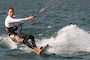 Kite surfers gathers speed off the predictably sturdy down-canyon winds  each morning on Lucky Peak Lake.