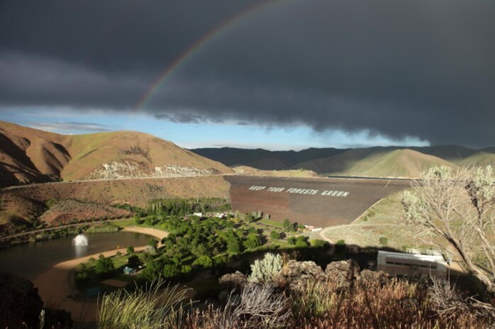 A rainbow reaches over Lucky Peak Dam and lands on the fountain at Lucky Peak State Park’s  Sandy Point Unit.