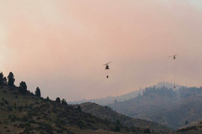 A Sky Crane fills it’s tank from the Mores Creek Arm of Lucky Peak Lake.  The Corps of Engineers and allied agencies work closely together to facilitate safe helicopter dipping operations from the lake to assist nearby firefights.
