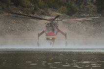 Fire hazards soar every summer around Lucky Peak Lake.  The Corps of Engineers and allied agencies work closely together to facilitate safe helicopter dipping operations from the lake to assist nearby firefights.