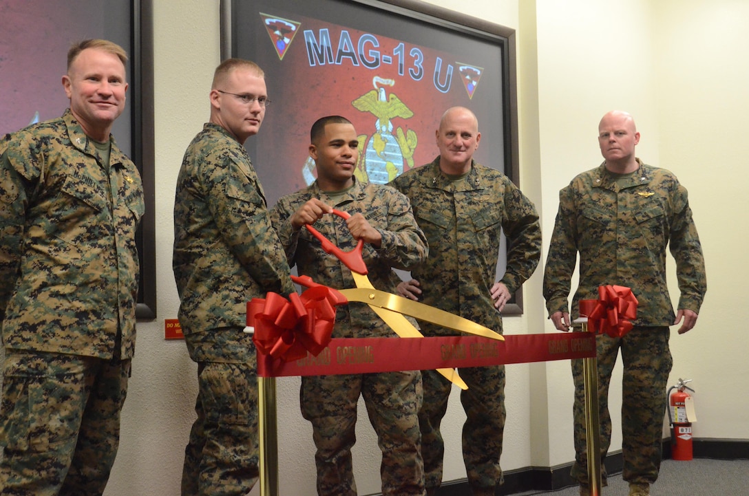 Marine Aircraft Group 13 (MAG-13), chain of command and non-commissioned officers stand by before cutting the ribbon at Ditto Hall, aboard Marine Corps Air Yuma, Ariz., on Tuesday.  MAG-13 is holding the grand opening for MAG-13 University corporals course with the help of Maj. Gen. Steven Busby, 3rd Marine Aircraft Wing Commanding General.  (Photo by Pfc. Aaron James Vinculado)