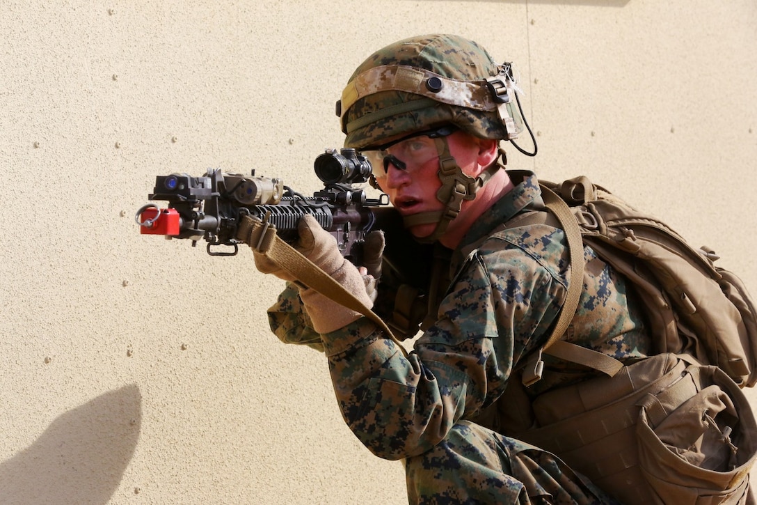 Lance Cpl. Hayden Parker, rifleman, Alpha Company, 1st Battalion, 5th Marine Regiment, and a native of Florence, Ariz., provides security for his fire team during an Urban Operations exercise at Marine Corps Base Camp Pendleton, Calif., Jan. 9, 2014. The training area tested the Marines’ knowledge and skills on operations in austere conditions. The range portrayed how an urban battlefield may look in a combat environment. (U.S. Marine Corps photo by Lance Cpl. Christopher J. Moore/Released)