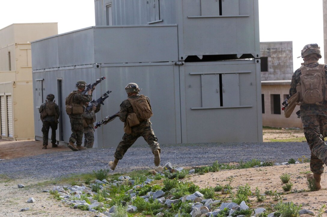 Marines with Alpha Company, 1st Battalion, 5th Marine Regiment, practice crossing a road during an Urban Operations exercise at Marine Corps Base Camp Pendleton, Calif., Jan. 9, 2014. UO can be more dangerous than an open battlefield because Marines have the possibility of close quarter combat that puts them face-to-face with the enemy. It requires Marines to be extra cautious and aware of their environment. (U.S. Marine Corps photo by Lance Cpl. Christopher J. Moore/Released)