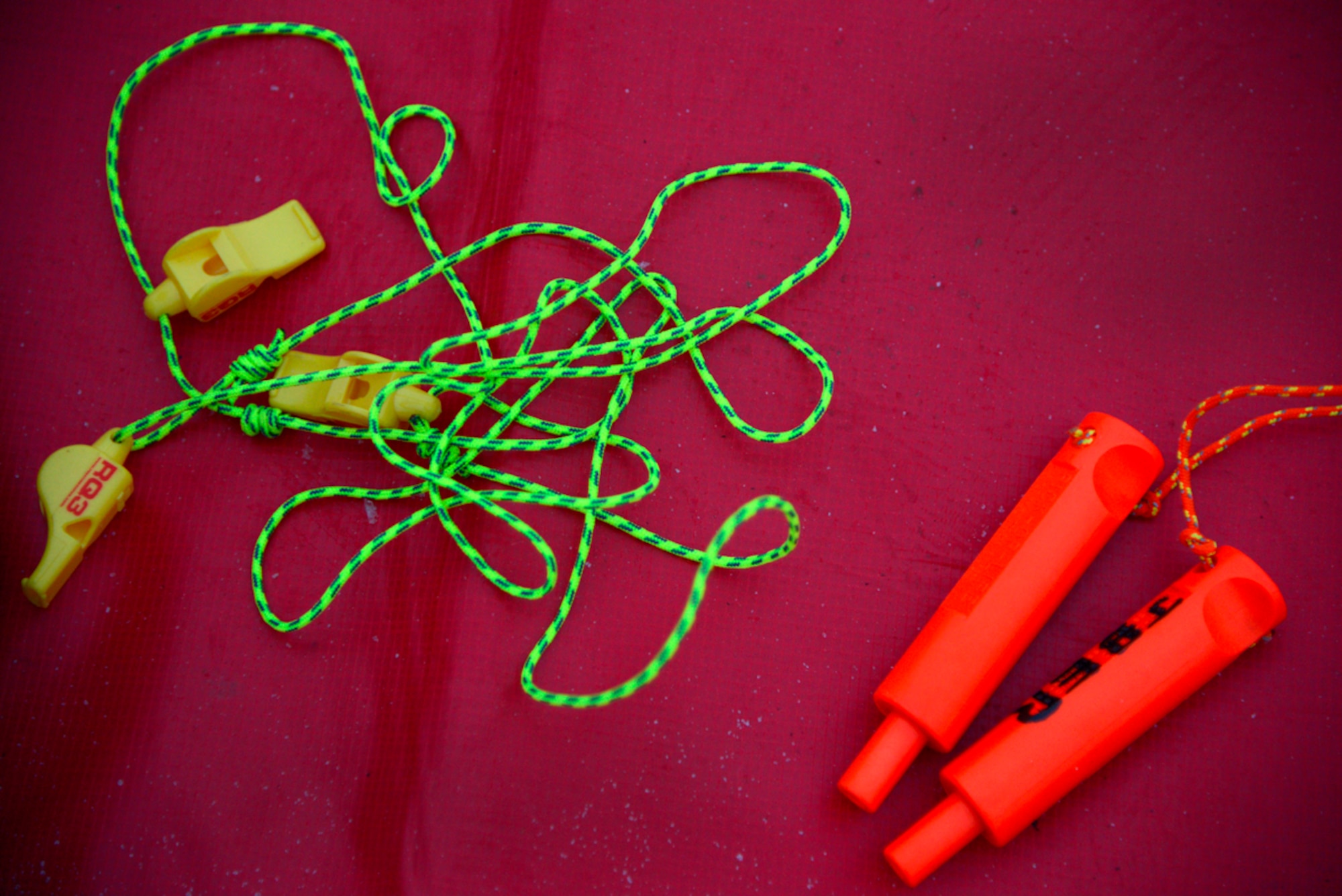 A whistle and pick-of-life are just two pieces of the rescue equipment used by the 673d Civil Engineer Squadron firefighters during marine, water and ice rescue training. (U.S. Air Force photo/Staff Sgt. Sheila deVera)