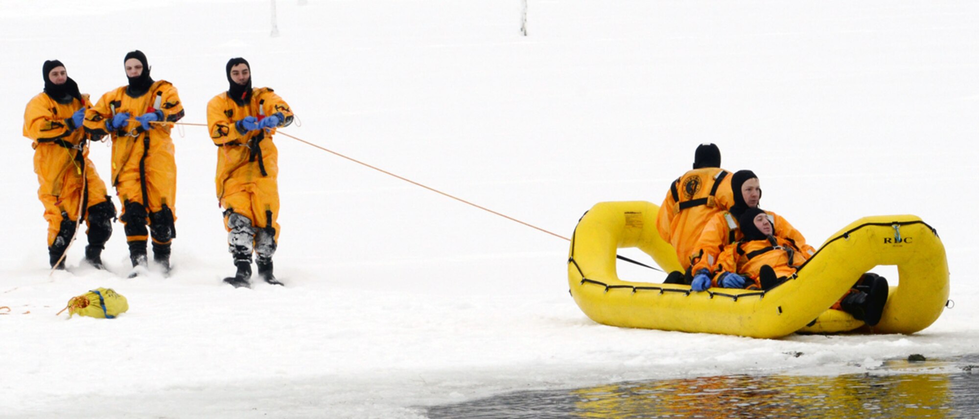 JOINT BASE ELMENDORF-RICHARDSON, Alaska -- 673d Civil Engineer Squadron military and Department of Defense firefighters practice ice water rescue techniques at Upper Otter lake on Joint Base Elmendorf-Richardson Jan. 11. The firefighters train their staff annually to stay proficient in ice water rescue since Alaska lakes are froze nine to 10 months of the year. (U.S. Air Force photo/Airman 1st Class Ty-Rico Lea)
