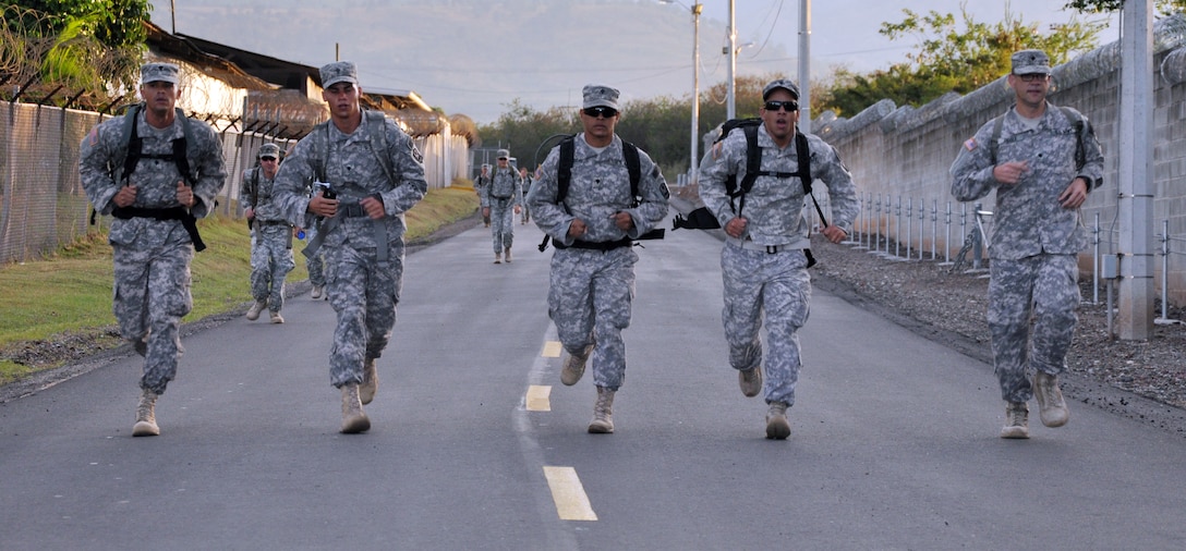 Members of Joint Task Force-Bravo participate in a road march as part of the German Armed Forces Proficiency Badge Qualification test at Soto Cano Air Base, Honduras, Jan. 14, 2014.  Forty members of Joint Task Force-Bravo earned the badge over three days of testing.  (U.S. Air Force photo by Capt. Zach Anderson)