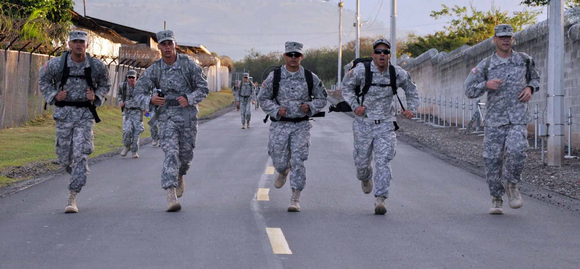 Members of Joint Task Force-Bravo participate in a road march as part of the German Armed Forces Proficiency Badge Qualification test at Soto Cano Air Base, Honduras, Jan. 14, 2014.  Forty members of Joint Task Force-Bravo earned the badge over three days of testing.  (U.S. Air Force photo by Capt. Zach Anderson)