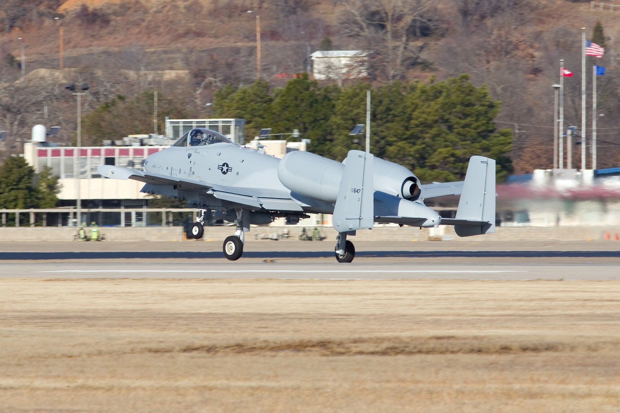 An A-10C Thunderbolt II "Warthog" (Tail No. 0647) takes off from the 188th Fighter Wing for Moody Air Force Base, Ga., Jan. 15, 2014. Tail Nos. 0129 and 0647 were transferred from the 188th’s Ebbing Air National Guard Base, Fort Smith, Ark., as part of the wing’s on-going conversion from a fighter mission to remotely piloted aircraft and Intelligence mission, which will include a space-focused targeting squadron. The 188th now has nine remaining A-10s left on station. The A-10s will join Moody AFB’s 75th Fighter Squadron. (Courtesy photo by Nick Thomas)