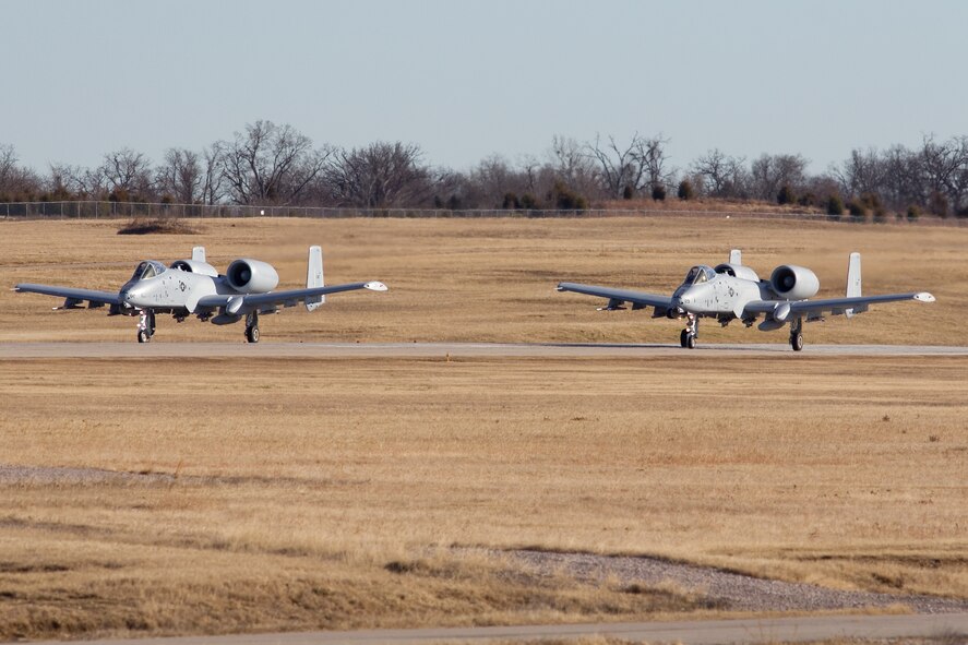 Two A-10C Thunderbolt II "Warthogs" prepare to depart the 188th Fighter Wing for Moody Air Force Base, Ga., Jan. 15, 2014. Tail Nos. 0129 and 0647 were transferred from the 188th’s Ebbing Air National Guard Base, Fort Smith, Ark., as part of the wing’s on-going conversion from a fighter mission to remotely piloted aircraft and Intelligence mission, which will include a space-focused targeting squadron. The 188th now has nine remaining A-10s left on station. The A-10s will join Moody AFB’s 75th Fighter Squadron. (Courtesy photo by Nick Thomas)