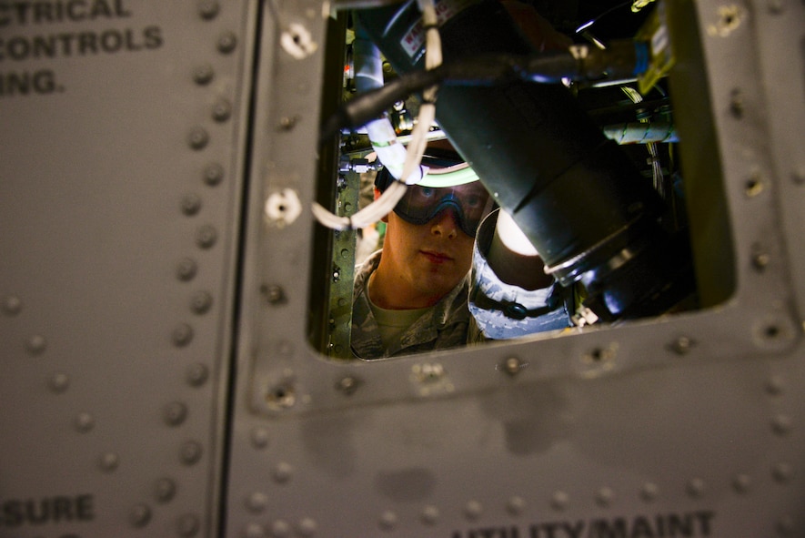 U.S. Air Force Airman 1st Class Benjamin Taylor, 723d  Aircraft Maintenance Squadron crew chief, services a strut on an HH-60G Pave Hawk during a Wing Readiness Exercise at Moody Air Force Base, Ga., Jan. 14, 2014. The maintainers prepared the HH-60 for transport on a C-17 Globemaster III during Moody’s first WRI. (U.S. Air Force photo by Airman 1st Class Sandra Marrero/Released)
